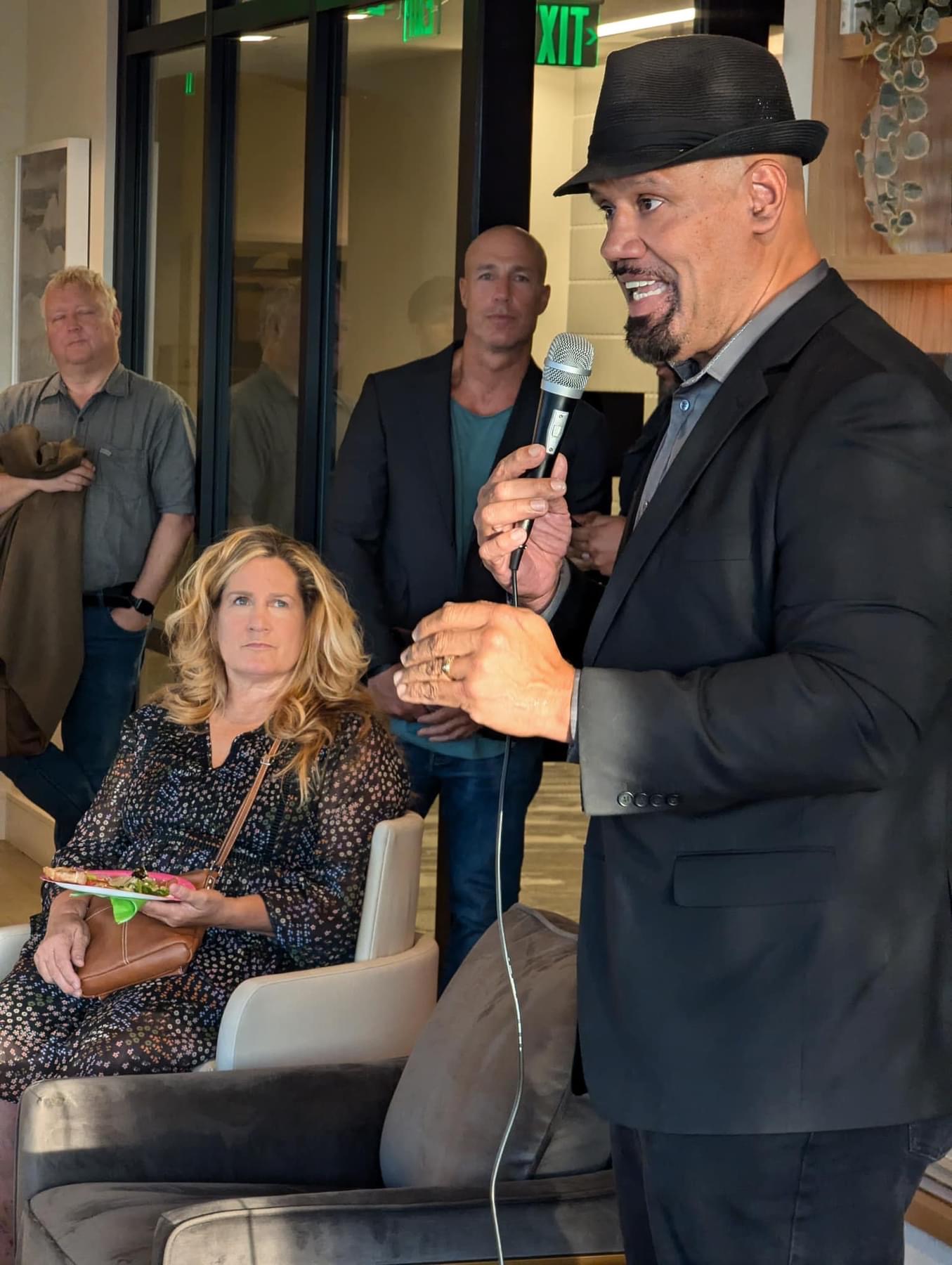 Host speaking into a microphone