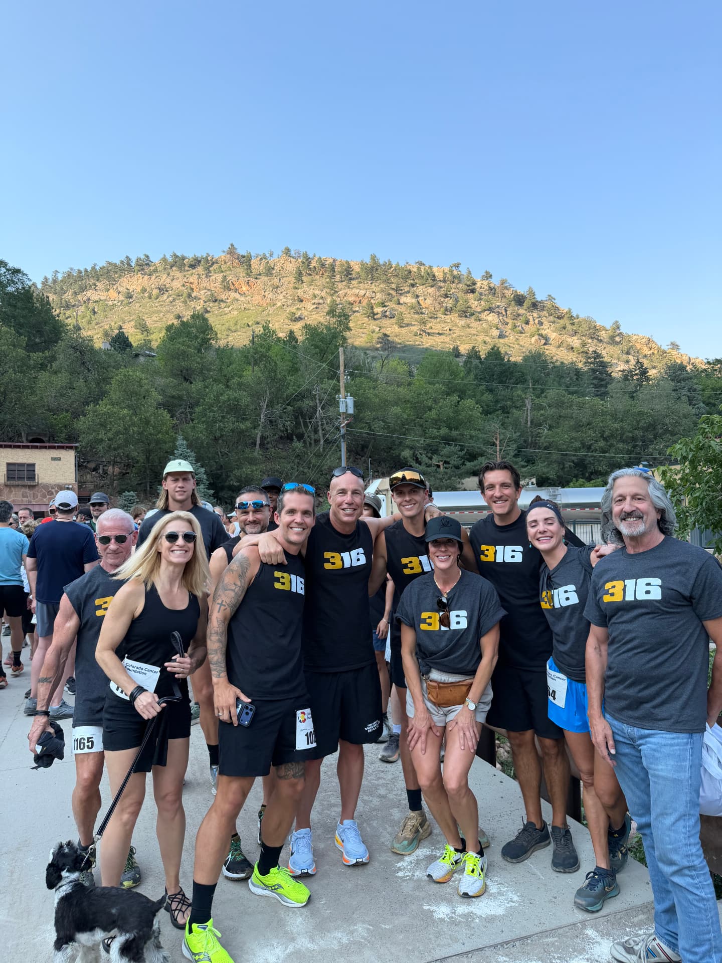 316 team gathered before the race with foothills behind them