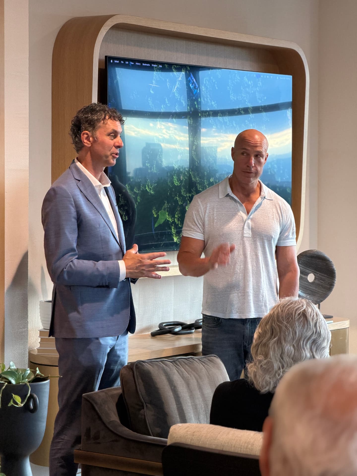 Glenn Hattem speaking alongside a guest presenter